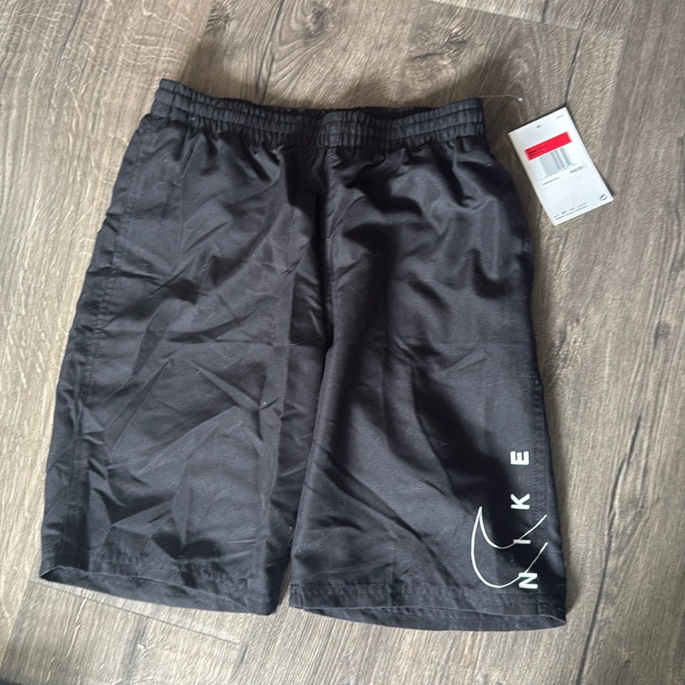 Black Nike swim trunks.